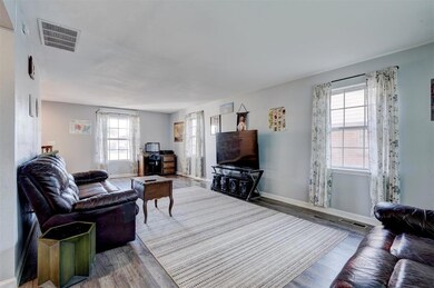 Living room with wood-type flooring