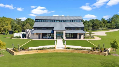 Rear view of property with a patio and a yard