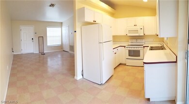 DINNING ROOM LOOKING AT LIVING ROOM (LEFT) KITCHEN (RIGHT)