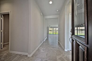 Grand Entry with High Ceilings, beautiful Large Tile Floors laid in an Upgraded brick Pattern and more.