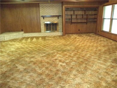 Den/Family. Den/family room w/ wood burning firepl