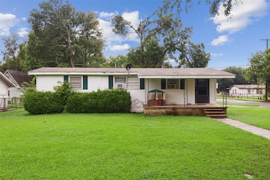 Single story home featuring a front yard