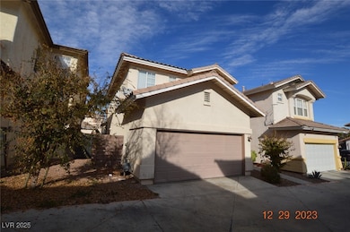 View of front of home with stucco siding, concrete