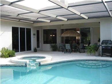 The screened outdoor area is made to feel like a part of the home when the many glass doors are open.