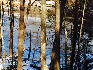 View of the Mousam River which leads...