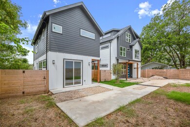 Rear view of house with board and batten siding, 