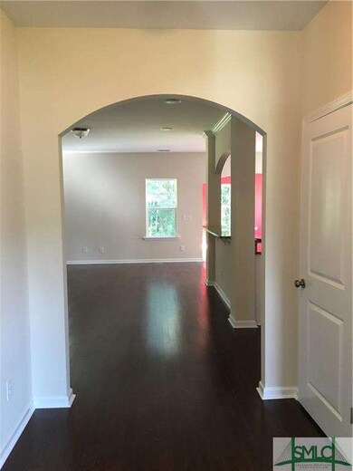 Archway leading from entry to family/kitchen