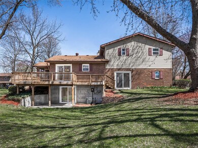 The rear of the home also includes an expansive deck off the kitchen, and lower level walkout patio.