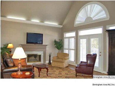 The great room is regal with custom designer ceili