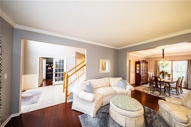 Living room with hardwood floor, picture window an