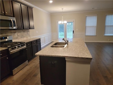 Kitchen with a sink, appliances with stainless ste