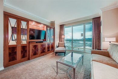 Living room featuring crown molding and light colored carpet