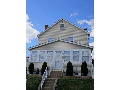 Exterior Front. Enclosed front porch sun room with