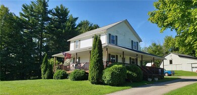 Adorable Colonial with wrap around porch, 2 barns 