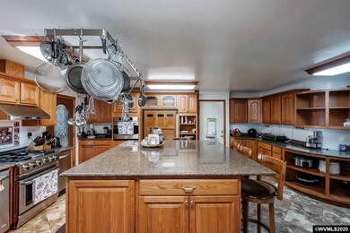 Commercial convection range and granite as far at the eye can see.