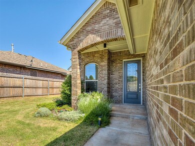 View of exterior entry with a yard