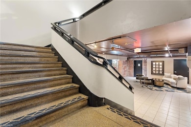 Building's original grand staircase leading up to the mezzanine level