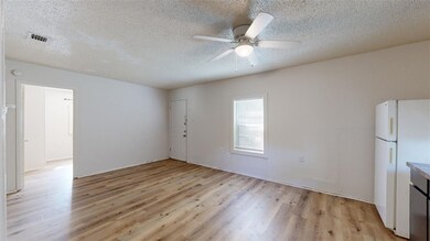 Spare room with visible vents, light wood-style fl