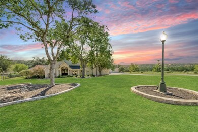 The home is tucked away down a long private driveway with a huge front yard.