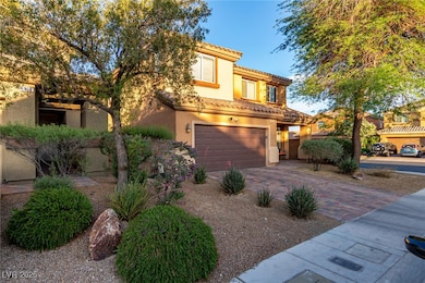 Mediterranean / spanish home with a garage, stucco