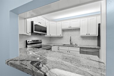 Breakfast bar to updated kitchen with granite counter tops
