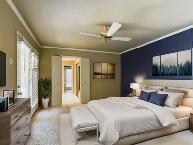 Bedroom featuring ceiling fan, light Carpet floori