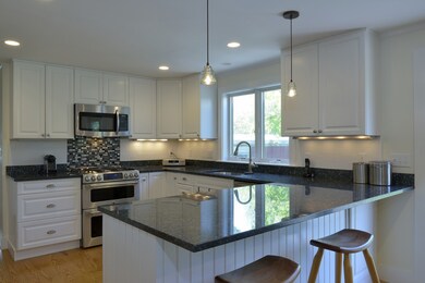 Kitchen- Granite counters, gas range, under cabinet lighting, lots of storage