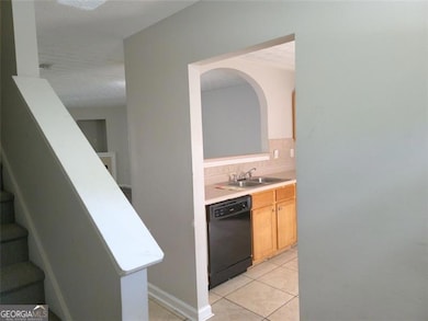 The nine-foot entry foyer with kitchen on right an