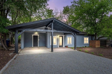 Mid-century modern home featuring stucco siding, 