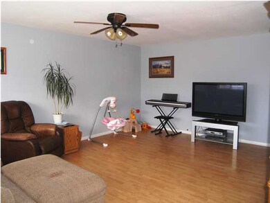 THE LIVING ROOM AS SEEN FROM THE FRONT DOOR.