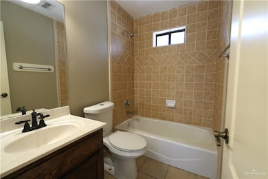 Full bathroom with vanity,  shower combination, and light tile patterned flooring
