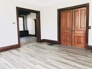 ANOTHER ANGLE OF THE LIVING ROOM, FACING THE FORMA