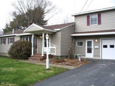 Exterior Front. The front has shrub...