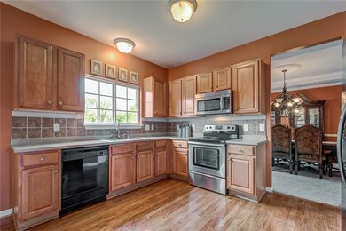 Bright, open kitchen - lots of light, gleaming hardwood floors