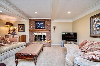 Brick fireplace, new neutral colored carpeting and