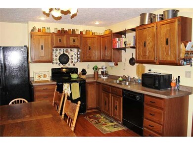 Kitchen. Here s another view of the kitchen.  The counter tops have been updated and the cabinet hardware too.