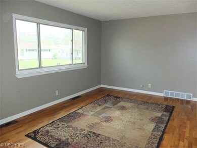 Living room with hardwood floor.