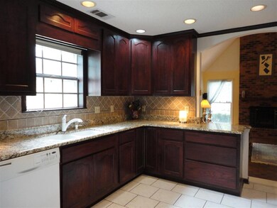 This cook's kitchen has granite, sparkling white a