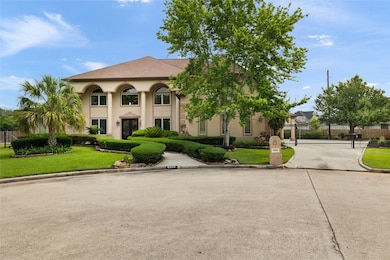 Nestled on a quiet cul-de-sac, this gated driveway
