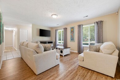 Living room featuring a textured ceiling and light