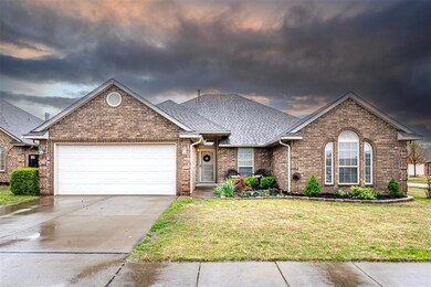 View of property with a yard and a garage