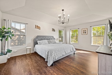 Spacious primary suite filled with natural light f