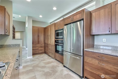 Kitchen view 2 towards entry, so much storage!