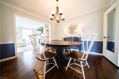 Dining Rm. with crown molding and refinished hardw