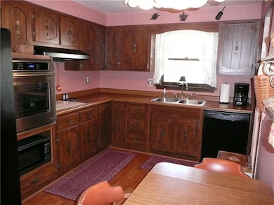 Eat-in Kitchen with wood grain vinyl flooring, new