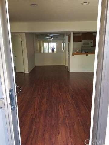 Living room to the dining room from backyard.