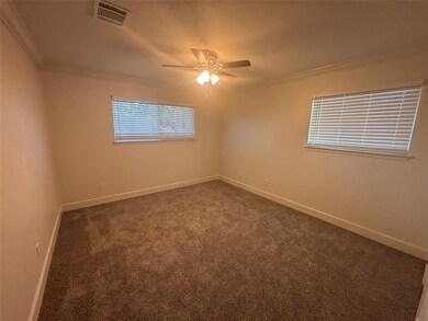 Unfurnished room with crown molding, carpet floor