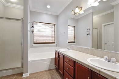 Your private Master Bathroom contains two sinks, a