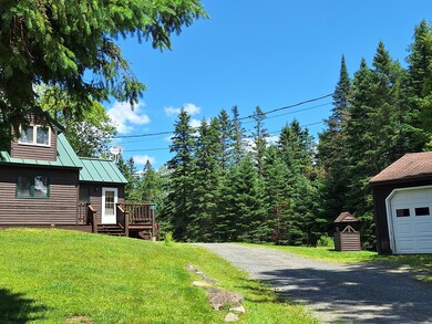 Former site of woodshed behind well