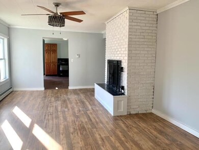 Living room with wood burning fireplace